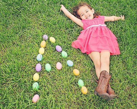 easter photo idea girl in grass with eggs