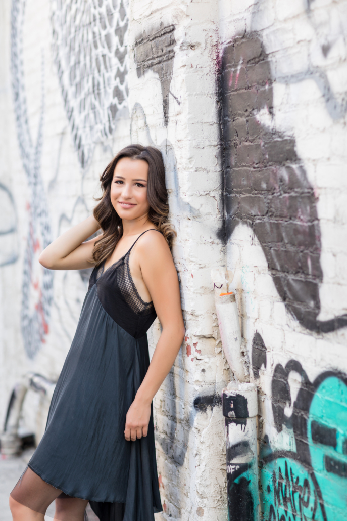 senior portrait with graffiti wall