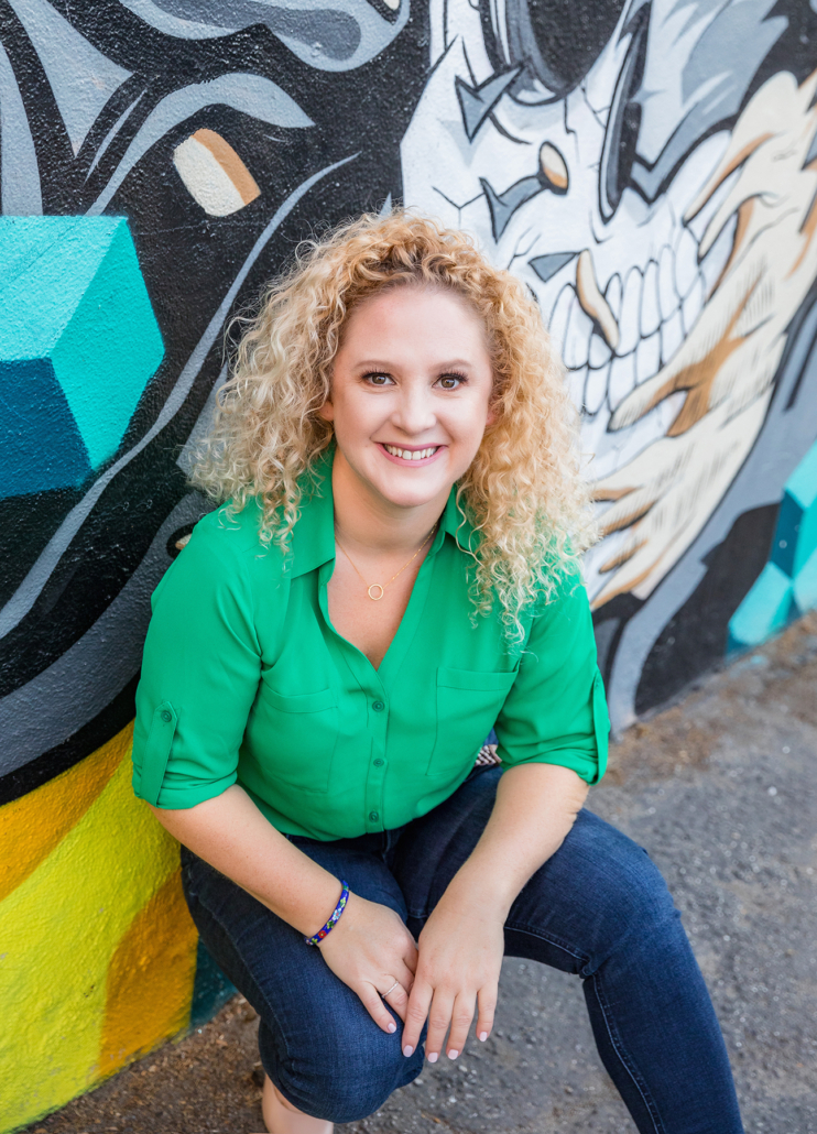 headshots on a graffiti wall