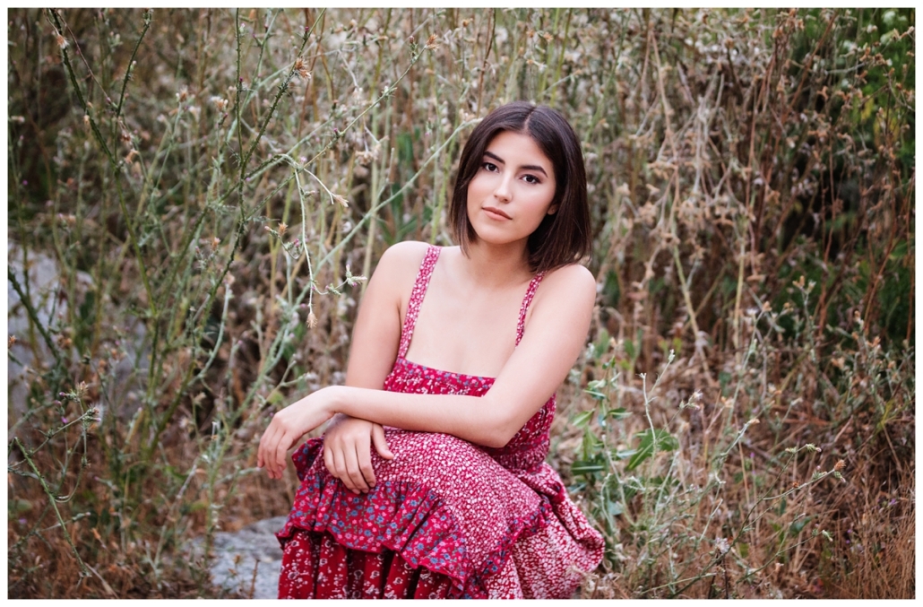 Free people red dress in a high school senior photoshoot in Laguna Canyon