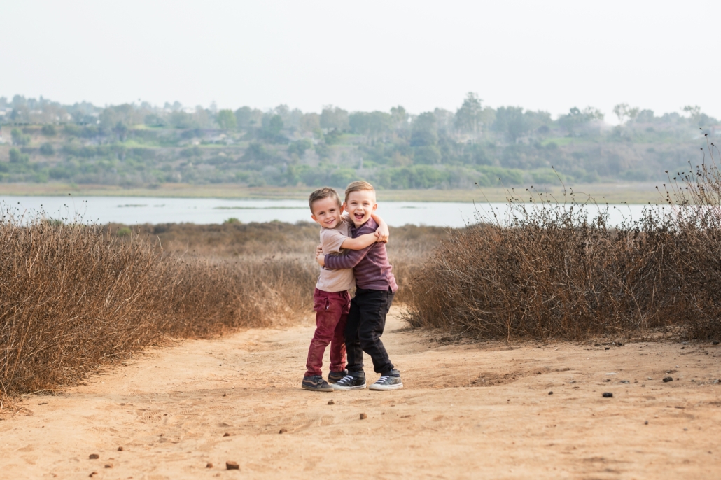 Brothers hugging during an Orange County Family photography session in the Back Bay