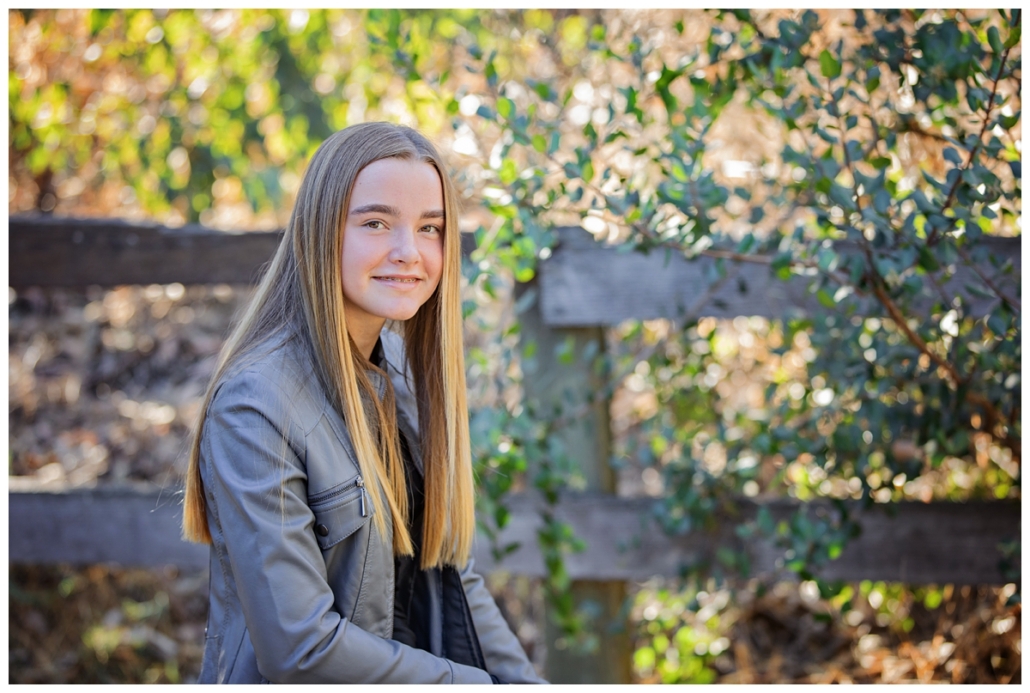 Tween girl photographed in Orange County with her family at a OC family portrait session.