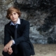 High School Senior guy photographed at the beach in a suit.