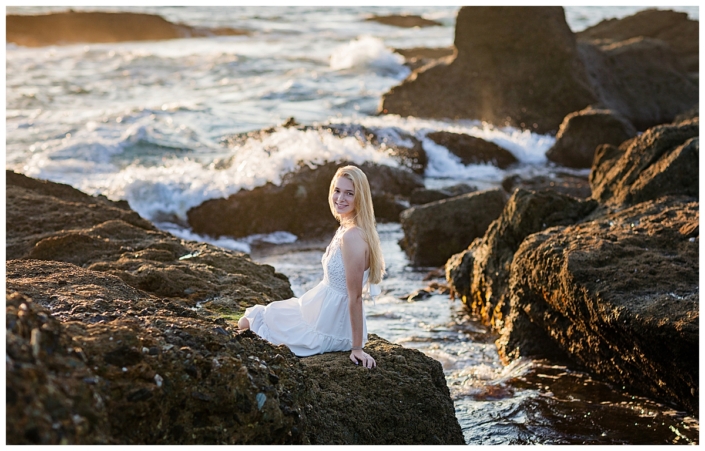 High School senior girl portraits on the rocks overlooking the ocean in Laguna Beach