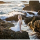 High School senior girl portraits on the rocks overlooking the ocean in Laguna Beach