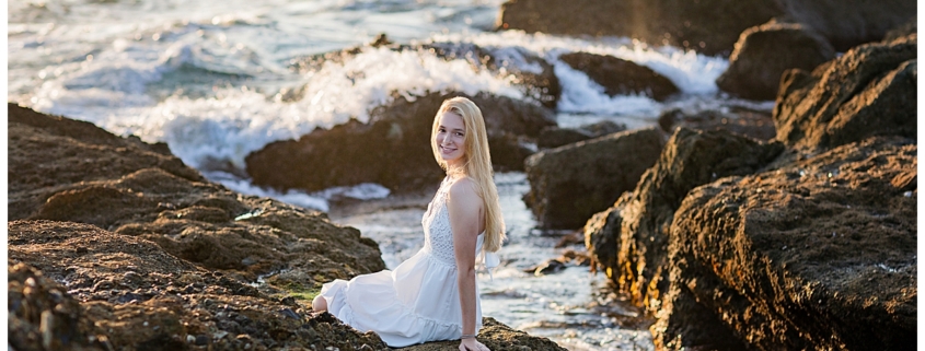 High School senior girl portraits on the rocks overlooking the ocean in Laguna Beach