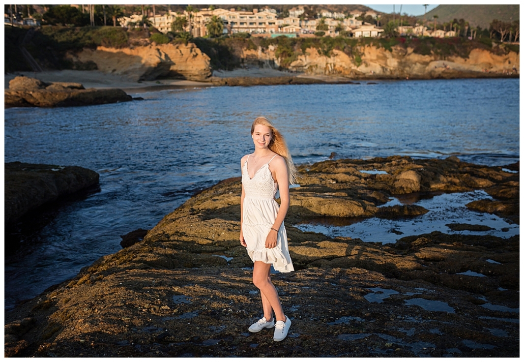 High school senior portraits at Treasure Island beach in a white dress