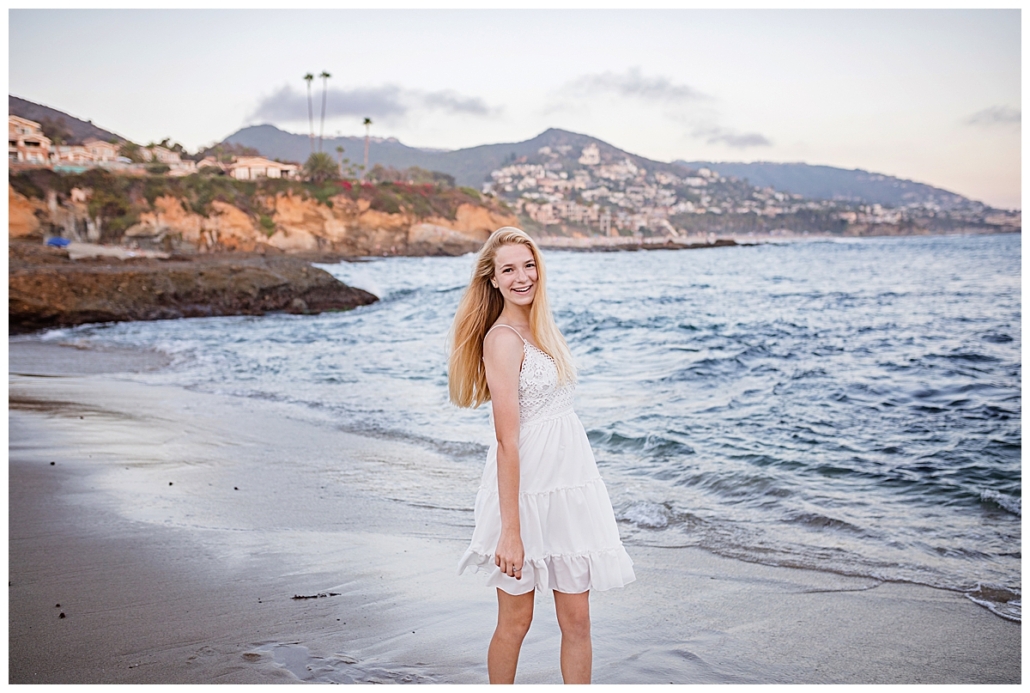 playing at the beach for high school senior portraits in Orange County