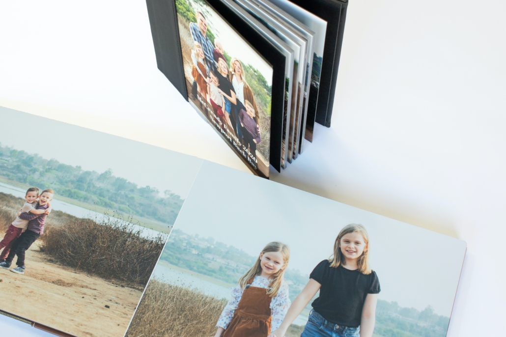 Custom designed heirloom album of a family with 5 kids under 10 years old in Upper Newport Back Bay