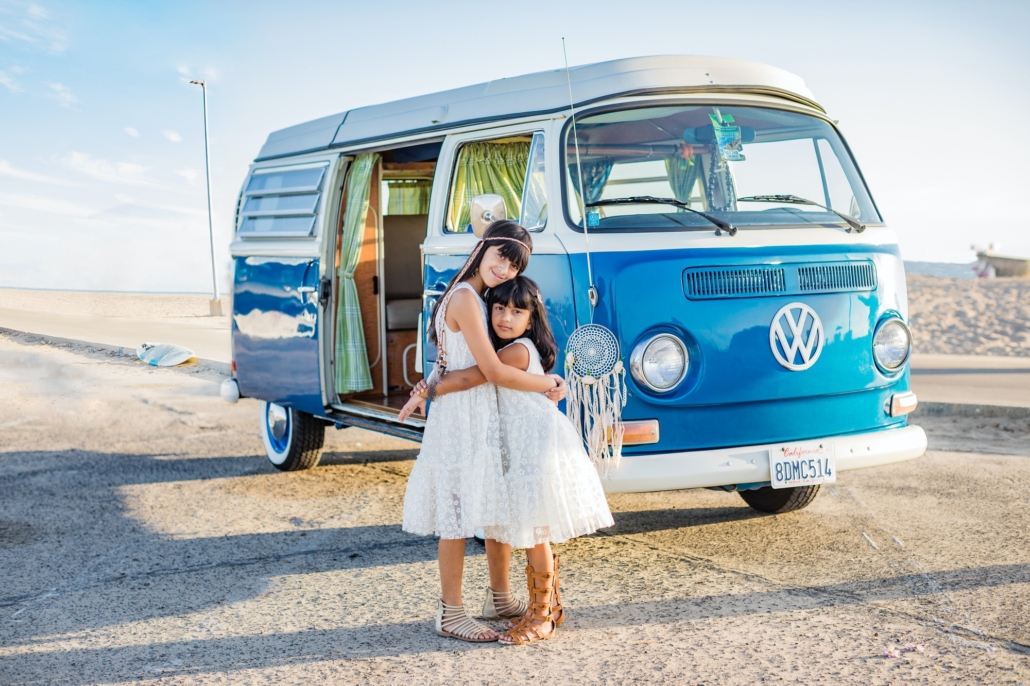 Sunset in Huntington Beach at a Family portrait session with a vintage VW van