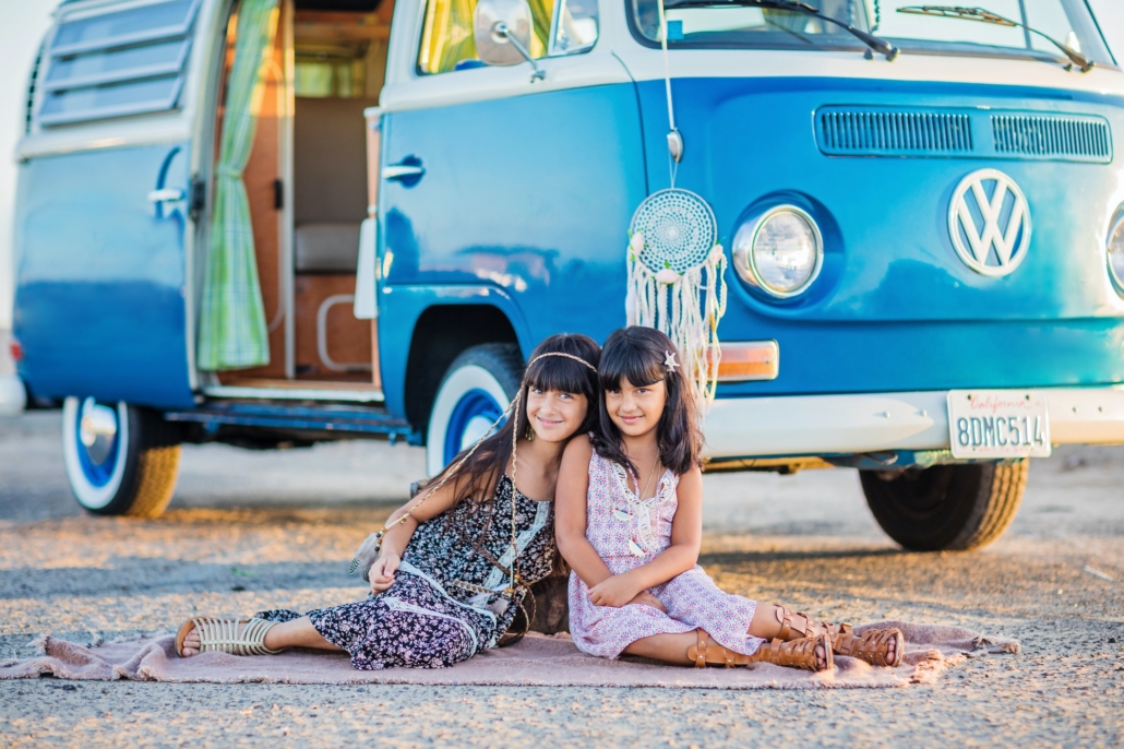 Siblings in Huntington beach doing a photo session with their vintage VW bus van