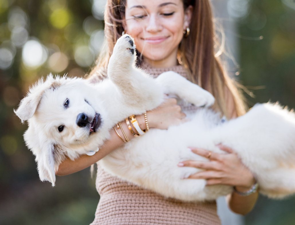 Candid posing idea with pet which is a new puppy in Laguna Niguel Regional park