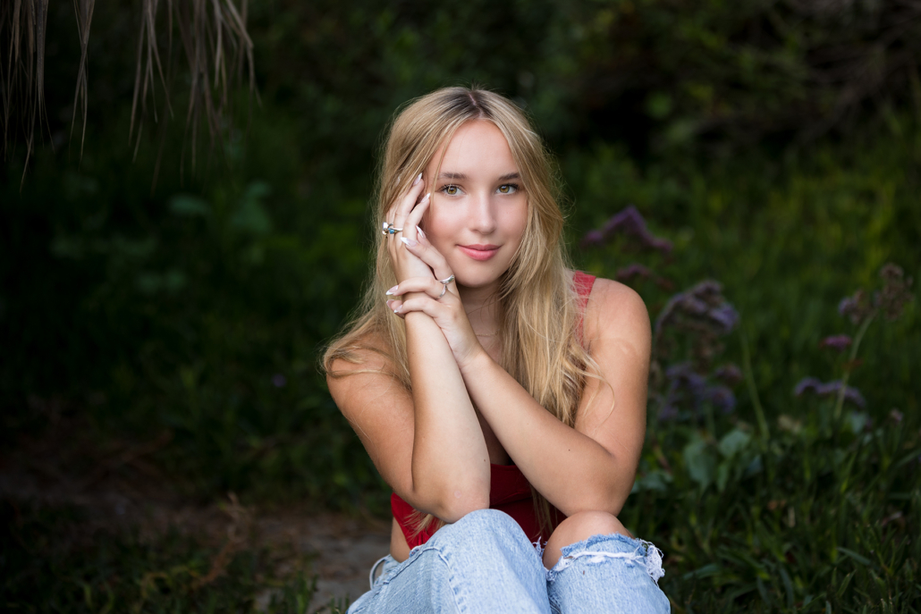 This Tablerock beach high school senior portrait session not only incorporated the sand and surf, but also the lush tropical garden area at the beach.