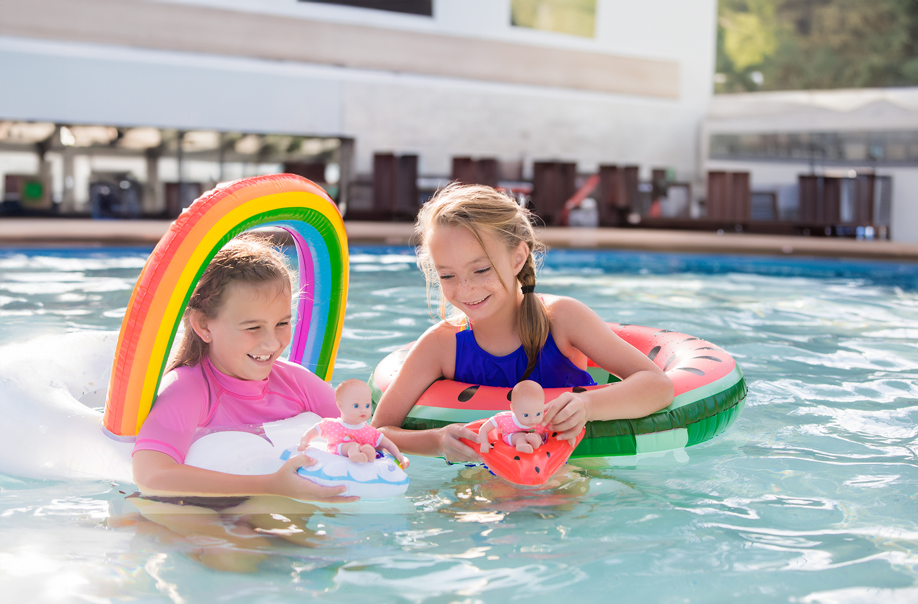 Consider booking your summer family photos poolside at your home or at a resort. 