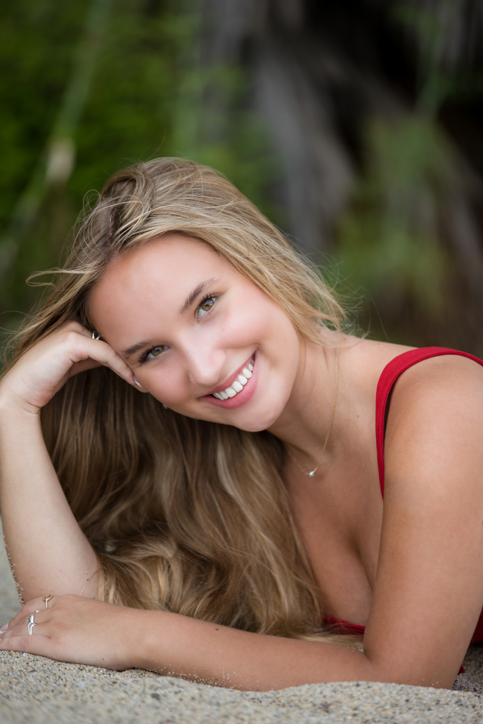 Close up headshot of a high school senior on the beach at Tablerock Beach. Tablerock beach is located in Laguna Beach and it is the perfect place for a high school senior portrait session.