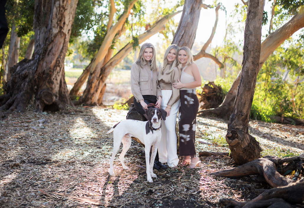 Family portraits with dog at Huntington Beach Central Park in Orange County. 