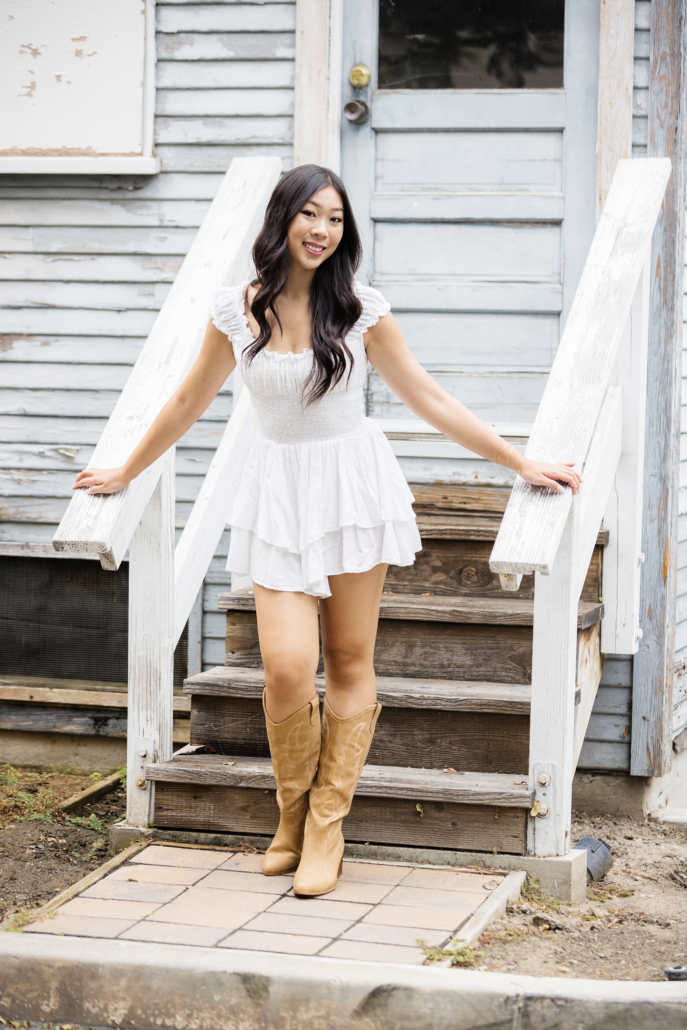 Downtown Laguna cottage is a unique location for a high school senior portrait session.