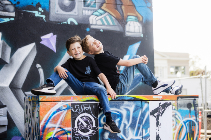 Brothers having fun during a family portrait session in downtown town Santa Ana Art District