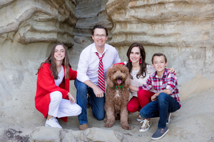 Orange County family smiling during a summer holiday photo session with Blue Skys Studio