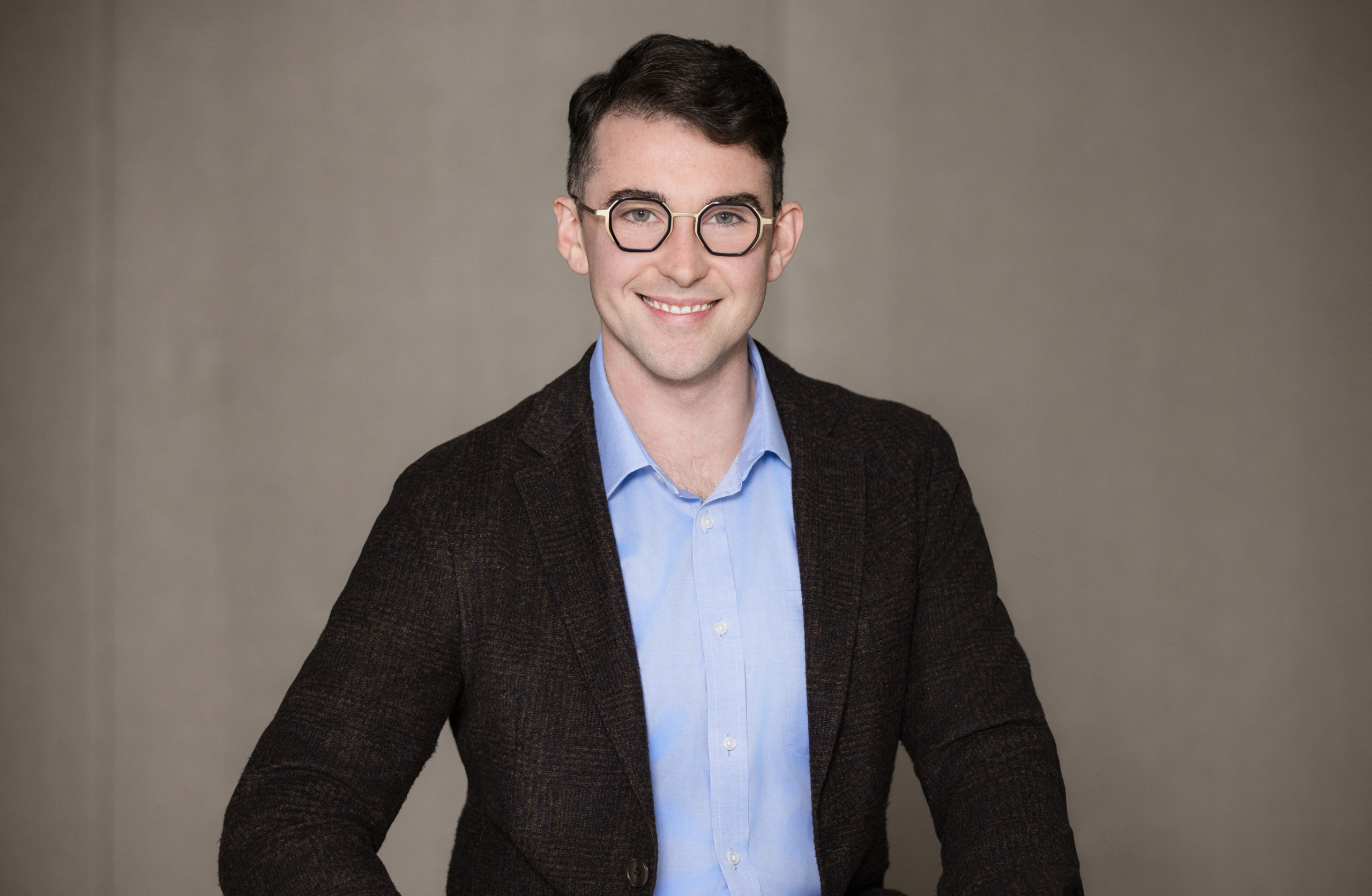client wearing classic suit from men’s headshot style guide