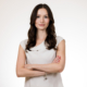 Professional woman in white blouse against a clean white studio backdrop