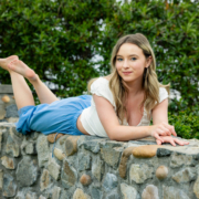 laguna-beach-senior-pictures-heisler-park-08 High school senior at photo session in Laguna Beach posing on a stone wall
