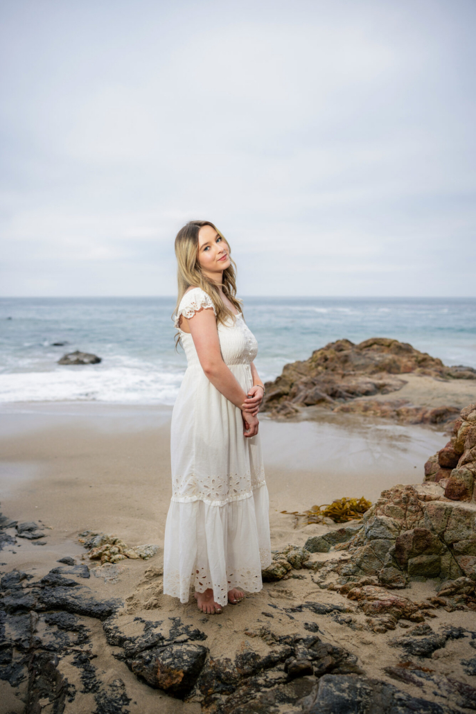 Laguna Beach senior wearing a styled outfit on the sand at Picnic Beach