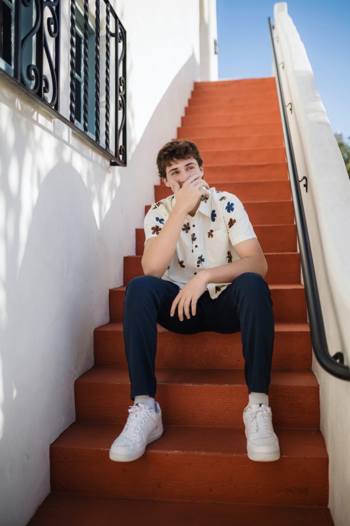 JSerra Catholic High School senior guy on Spanish terracotta steps in San Clemente